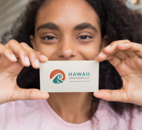 Image of brown skin girl holding business card